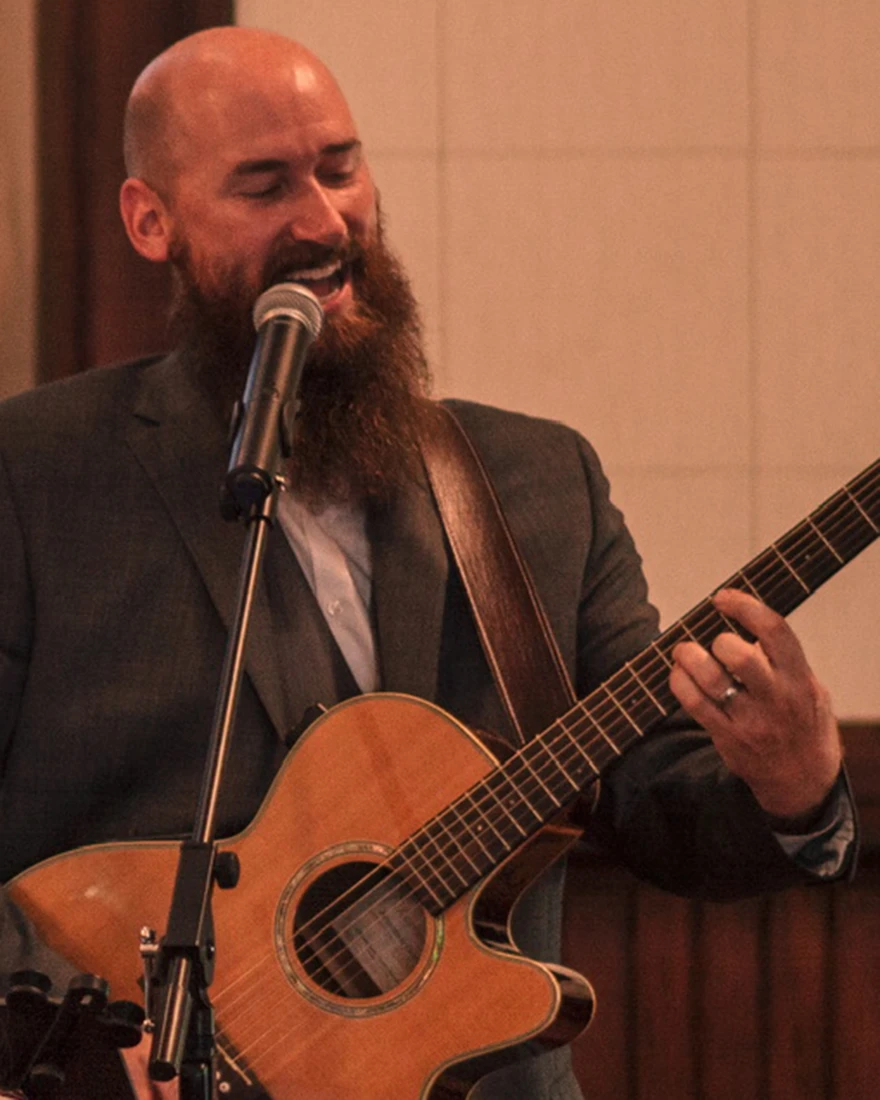 Charles Watson, Papa Charles, singing and playing guitar on stage