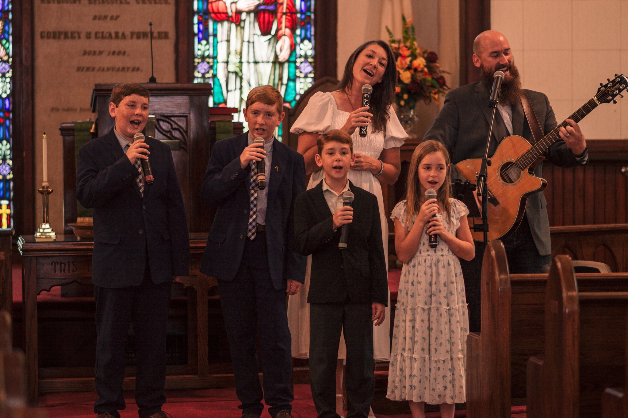 Our family singing together in a church sanctuary