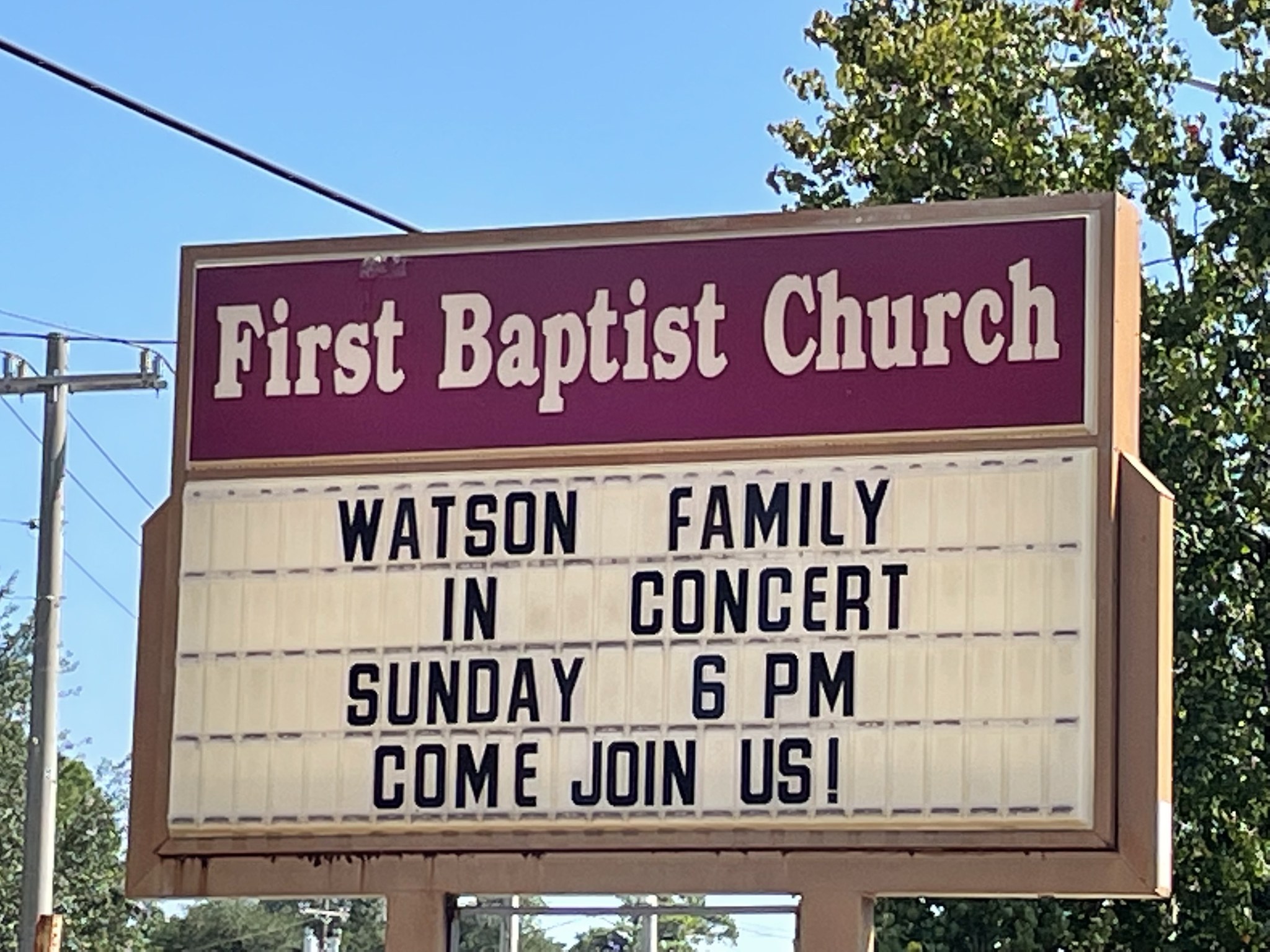 A church marquee reading Watson Family in Concert, with a warm welcome out front